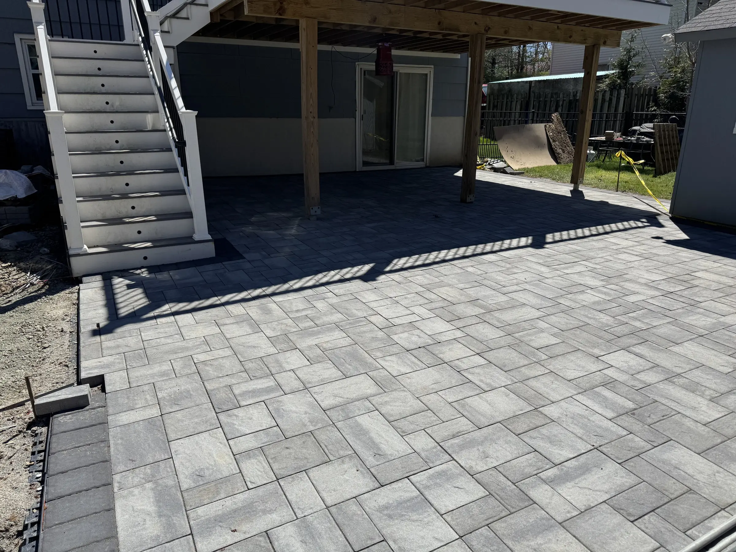 Paver patio under a deck