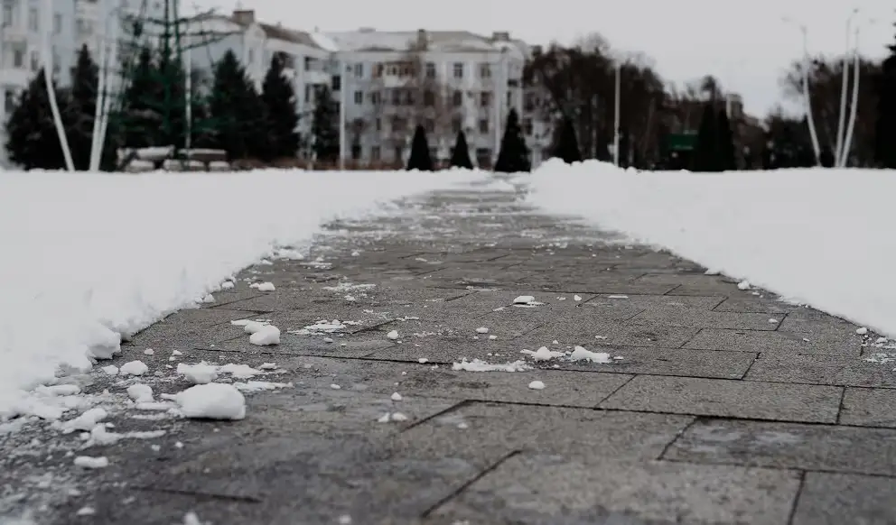 Snow-cleared paver walkway maintained by JCM Construction in Northern New Jersey