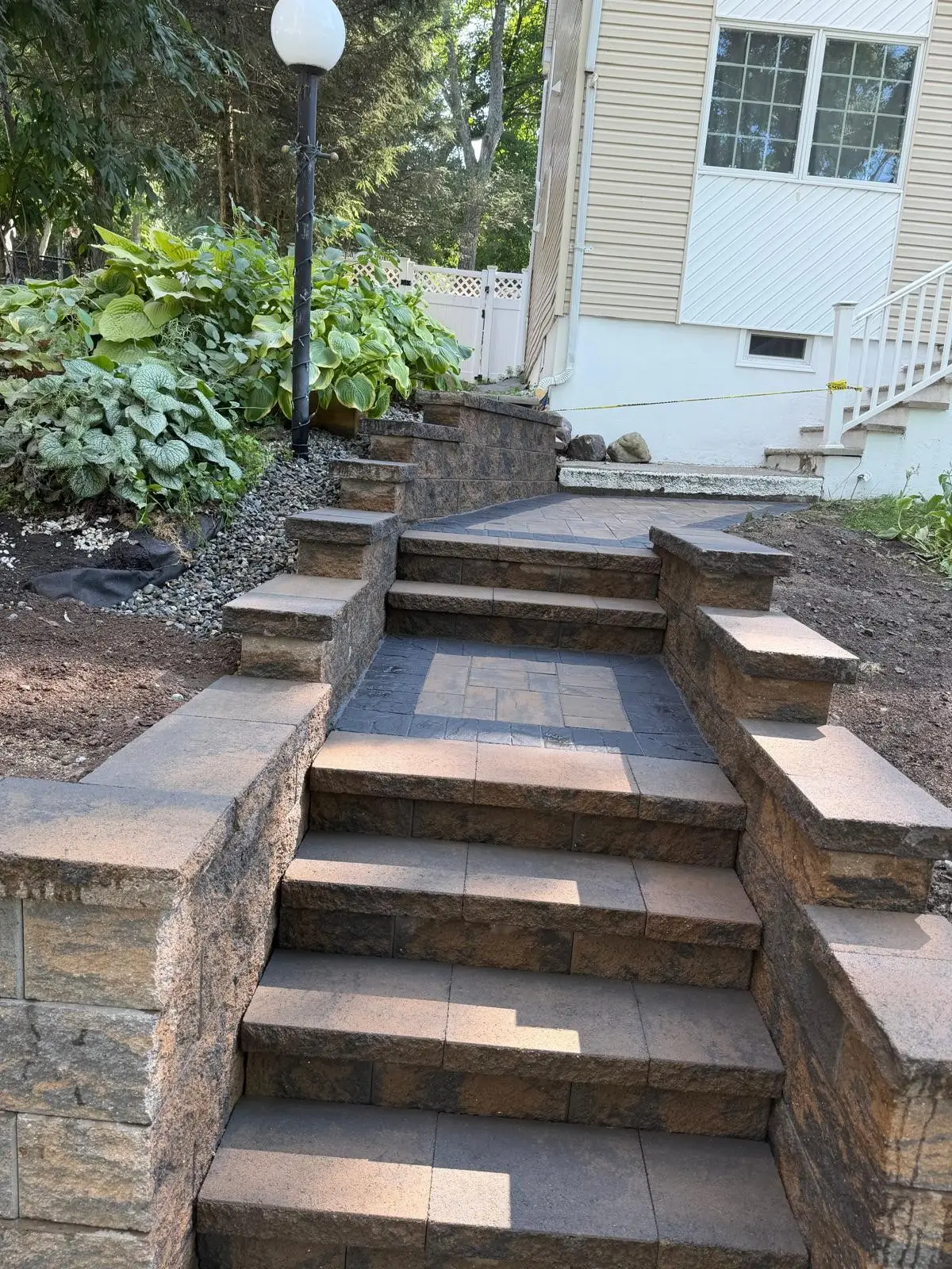 Stone steps between two retaining walls